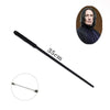 A long, black metal cosplay magic wand with a decorative handle and a portrait of a historical figure.