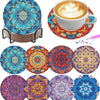 An assortment of eight diamond painting coasters in various colors and patterns displayed on a holder.
