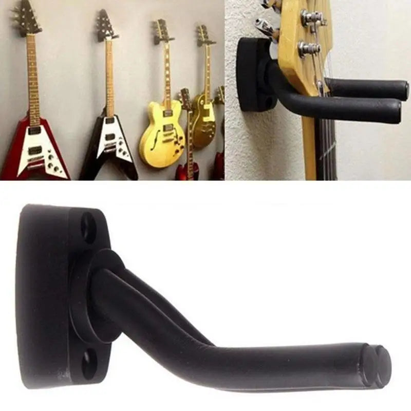 A black guitar wall mount hanger with soft padding, shown alongside several guitars.