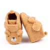 A pair of cute bear design baby prewalker shoes made of soft, fuzzy brown material.