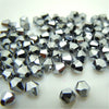 A pile of silver faceted glass bicone beads for jewelry making
