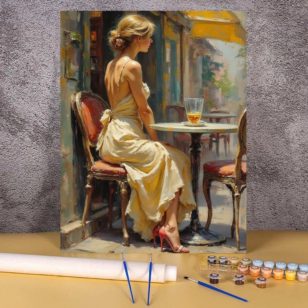 A painting by numbers kit depicting an elegant woman in a yellow dress sitting in a chair.