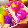 A pink plastic toy kitchen set featuring various cooking tools and play food items.