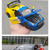 A yellow and blue Diecast GTR sports car model with racing decals is held in a hand.