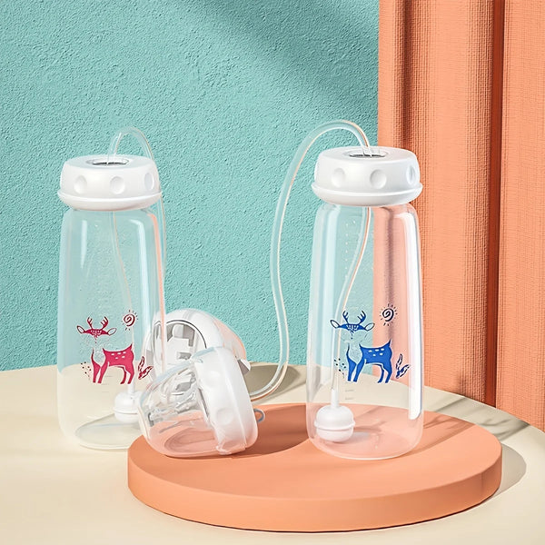 Clear silicone self-feeding bottles with attached straws and cleaning brushes displayed on a light wooden surface.