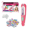 A pink hair kit box and several clear gemstone stamps for a kids craft project.