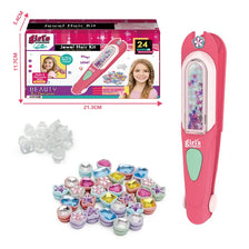 A pink hair kit box and several clear gemstone stamps for a kids craft project.
