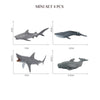 Mini set of four realistic ocean animal figurines including a whale, shark, dolphin, turtle, and penguin.