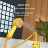 A yellow duck water spray bath toy is spraying water into a tub.