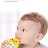 A baby is interacting with a yellow interactive chicken music and puzzle toy.
