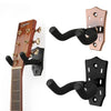 A close-up view of a guitar wall mount hanger with a padded yoke, shown attached to a guitar neck.