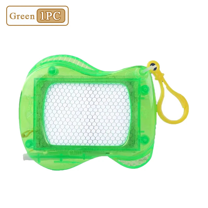 A green mini magnetic drawing board keychain with a clear grid surface and yellow lanyard.