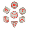 A set of silicone polyhedral dice, including a d6, d8, d10, and d20, are displayed on a white background.
