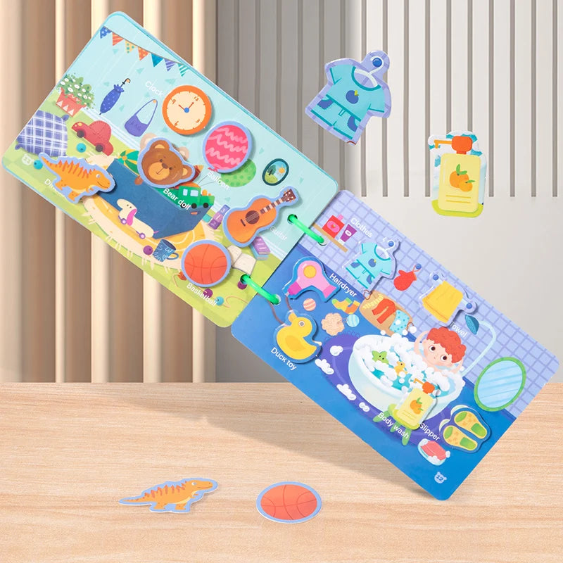 A colorful interactive quiet book for toddlers featuring various stickers and activities laid out on a wooden surface.