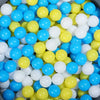 A bulk set of colorful plastic ocean ball pit toys in various shades of blue, yellow, and white.