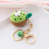 Handmade crochet avocado fruit keychain pendant with green skin and white center