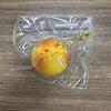 A yellow squishy potato fidget toy is visible inside a clear plastic bag on a wooden surface.