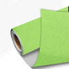 A roll of lime green linen book binding cloth used for albums and scrapbooks.
