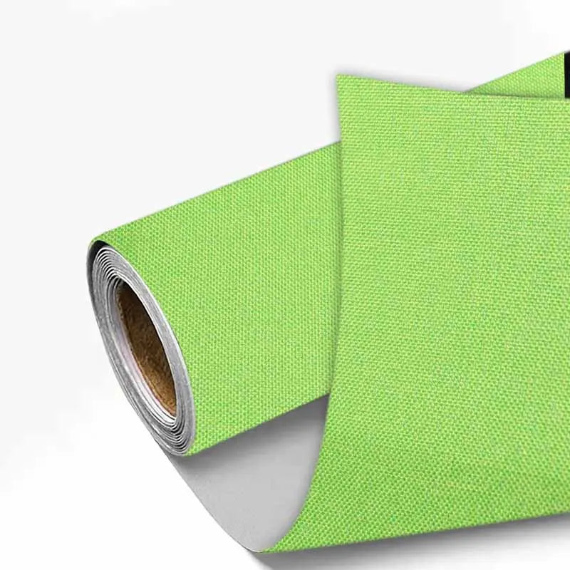 A roll of lime green linen book binding cloth used for albums and scrapbooks.