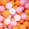 A bulk set of colorful plastic ocean ball pit toys in shades of orange and pink.