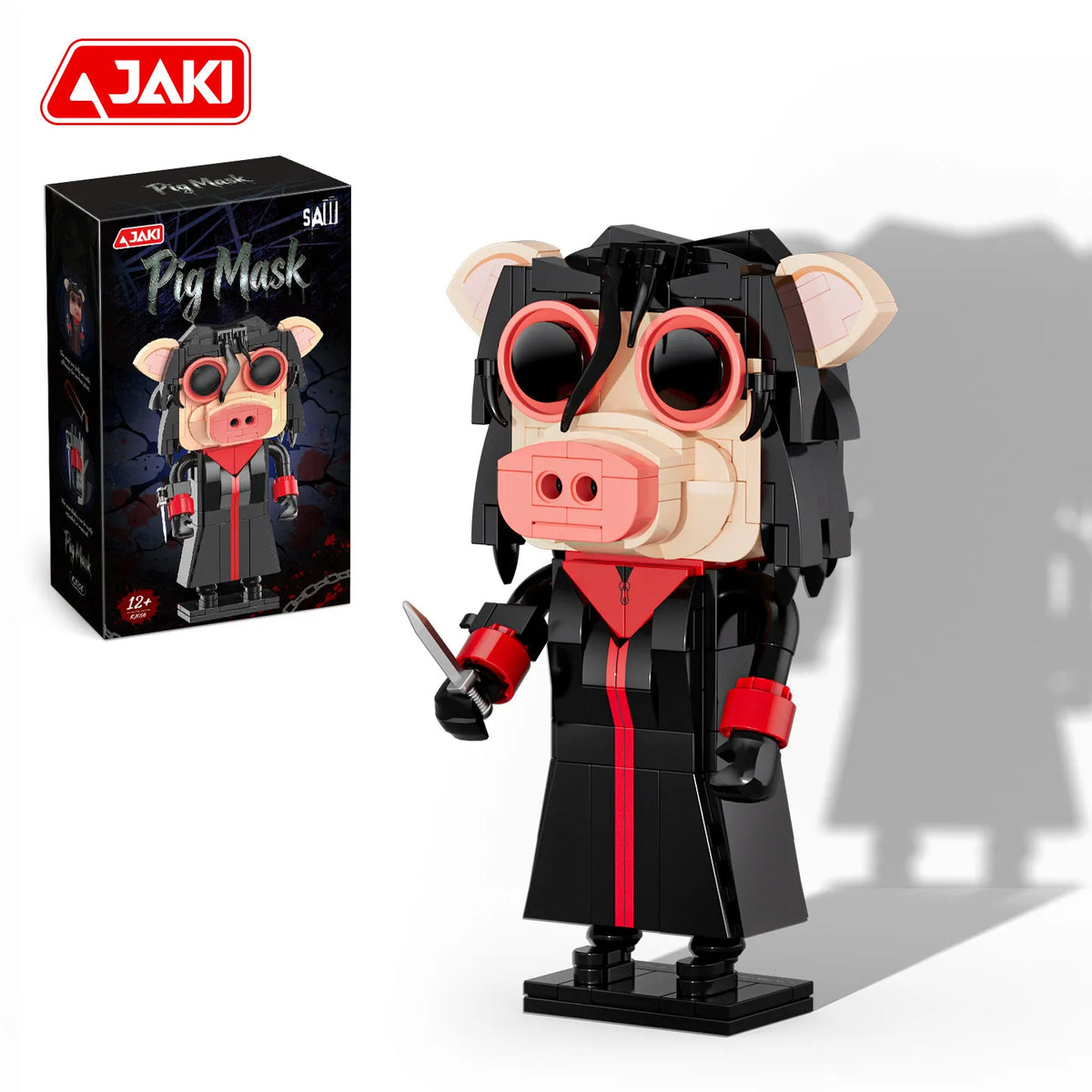 A black and pink pig mask puppet model building set featuring a pig character with large eyes and horns.
