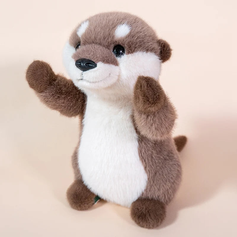 A soft brown and white otter plush toy with large eyes and a smiling expression.