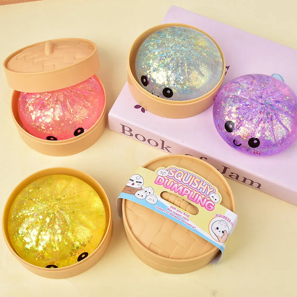 A collection of glitter squishy dumplings in various colors and shapes displayed on a light background.