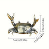 Brass crab figurine statue showing its detailed claws and body structure.