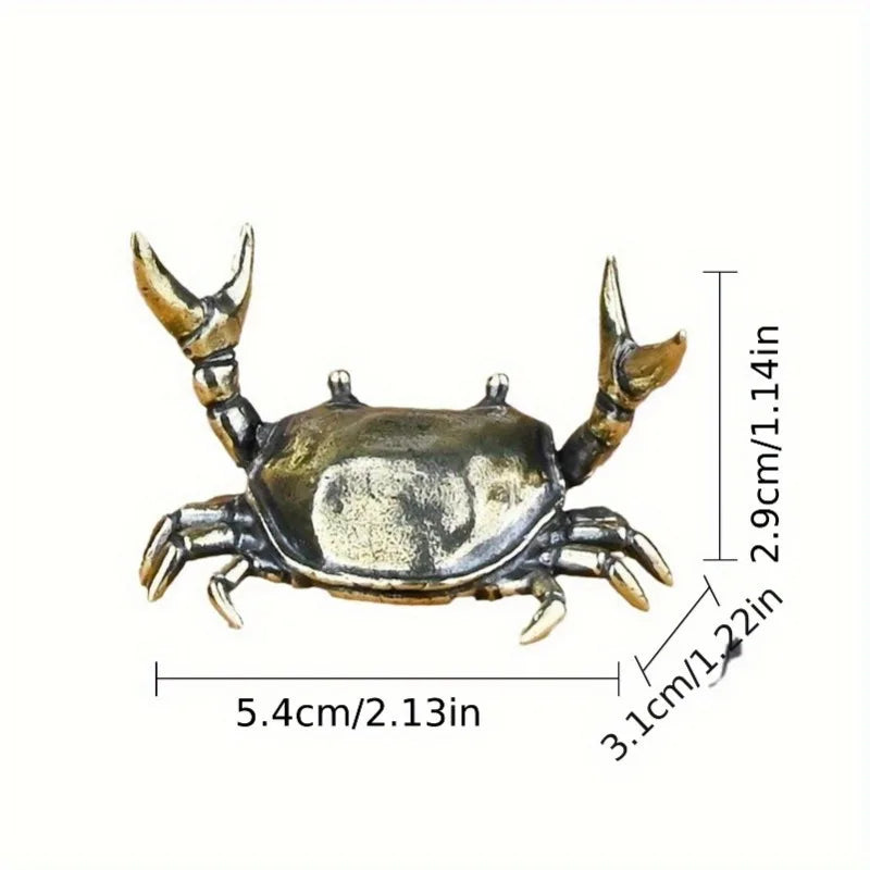 Brass crab figurine statue showing its detailed claws and body structure.