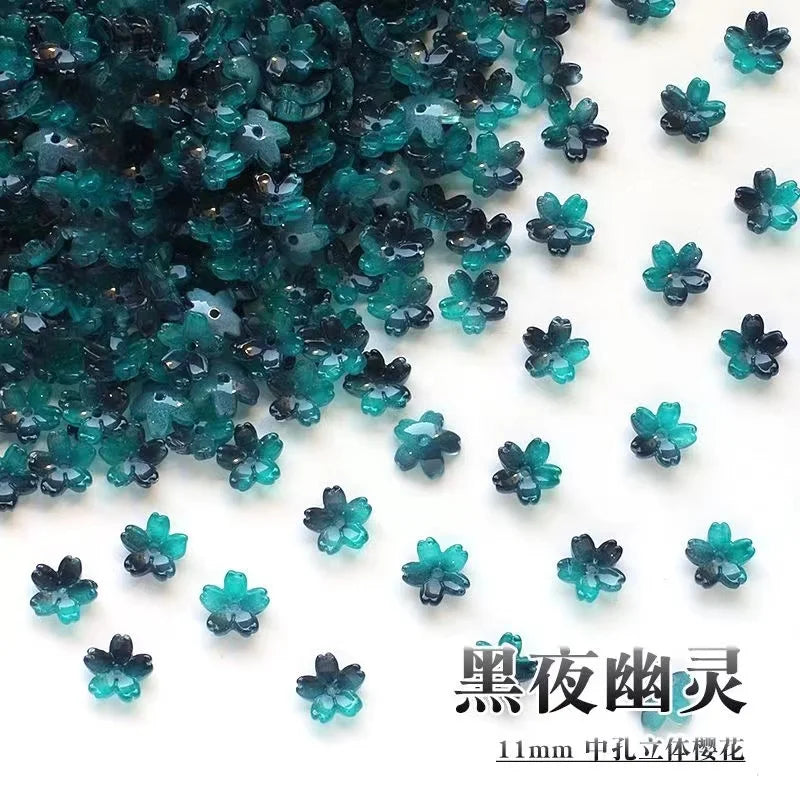 Dark teal glass beads shaped like sakura flowers for jewelry making