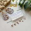 Two sets of silicone molds featuring starfish and seashell shapes for crafting