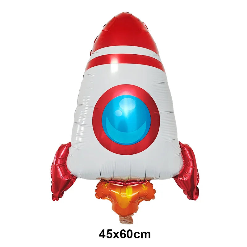 A red and white foil balloon shaped like a rocket with a blue eye design for birthday party decor