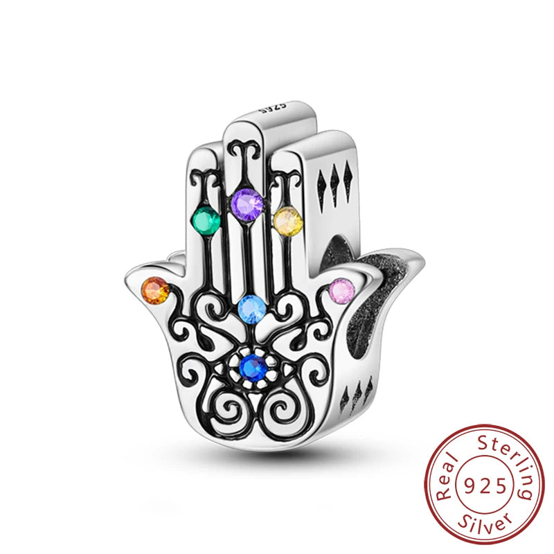 A sterling silver charm beads set featuring cross, angel, and evil eye designs for DIY jewelry making.