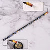 A long, slender pen with a decorative body and a tip showing loose wax nail rhinestones.