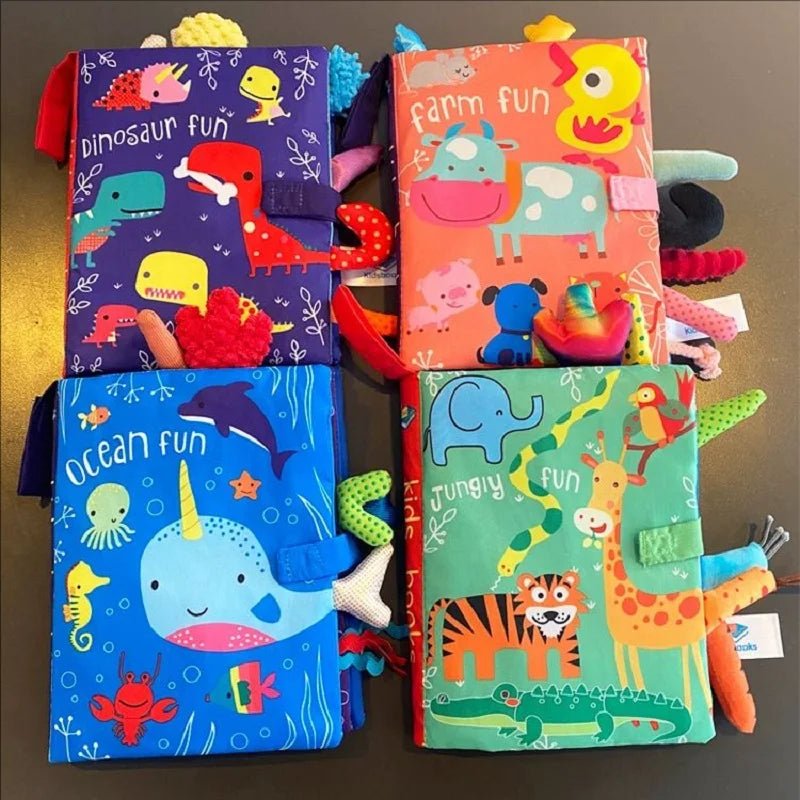 A collection of colorful soft sensory cloth books featuring animals and fun themes for babies.