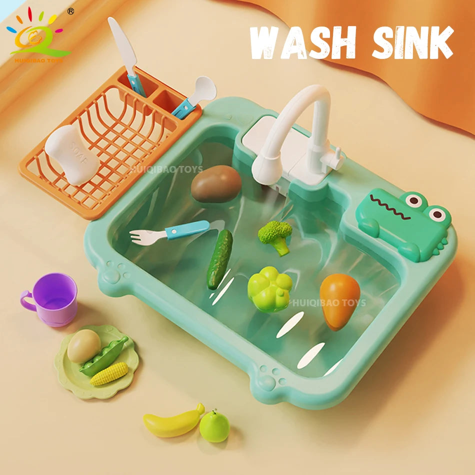 A green plastic kids play sink with a faucet and various fruits and vegetables for water circulation and fishing games.
