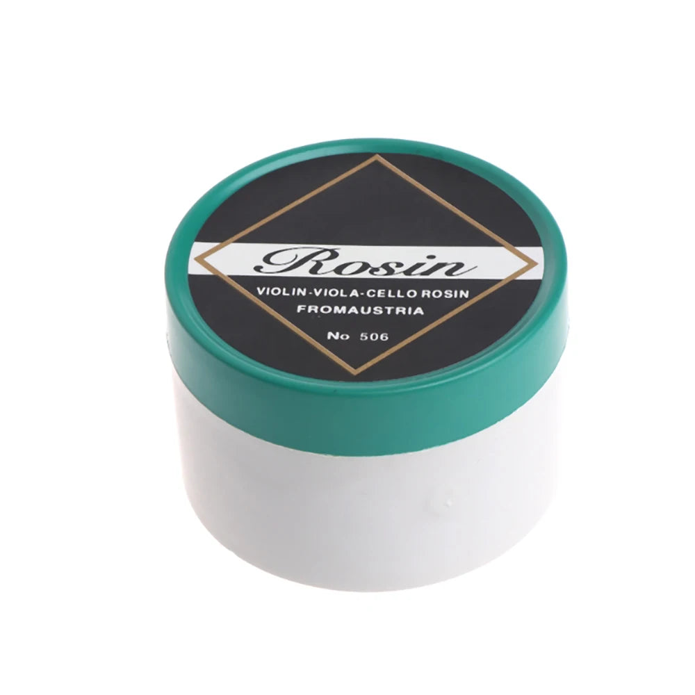 A round tin of rosin labeled Rosin for violin, viola, cello, and fromaustria