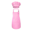 A pink kids chef apron and hat set displayed against a white background.