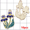 Ten gold-toned enamel flower charms featuring blue and yellow details on a white grid background.