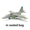 A detailed military model airplane in camouflage paint is shown in a sealed bag.