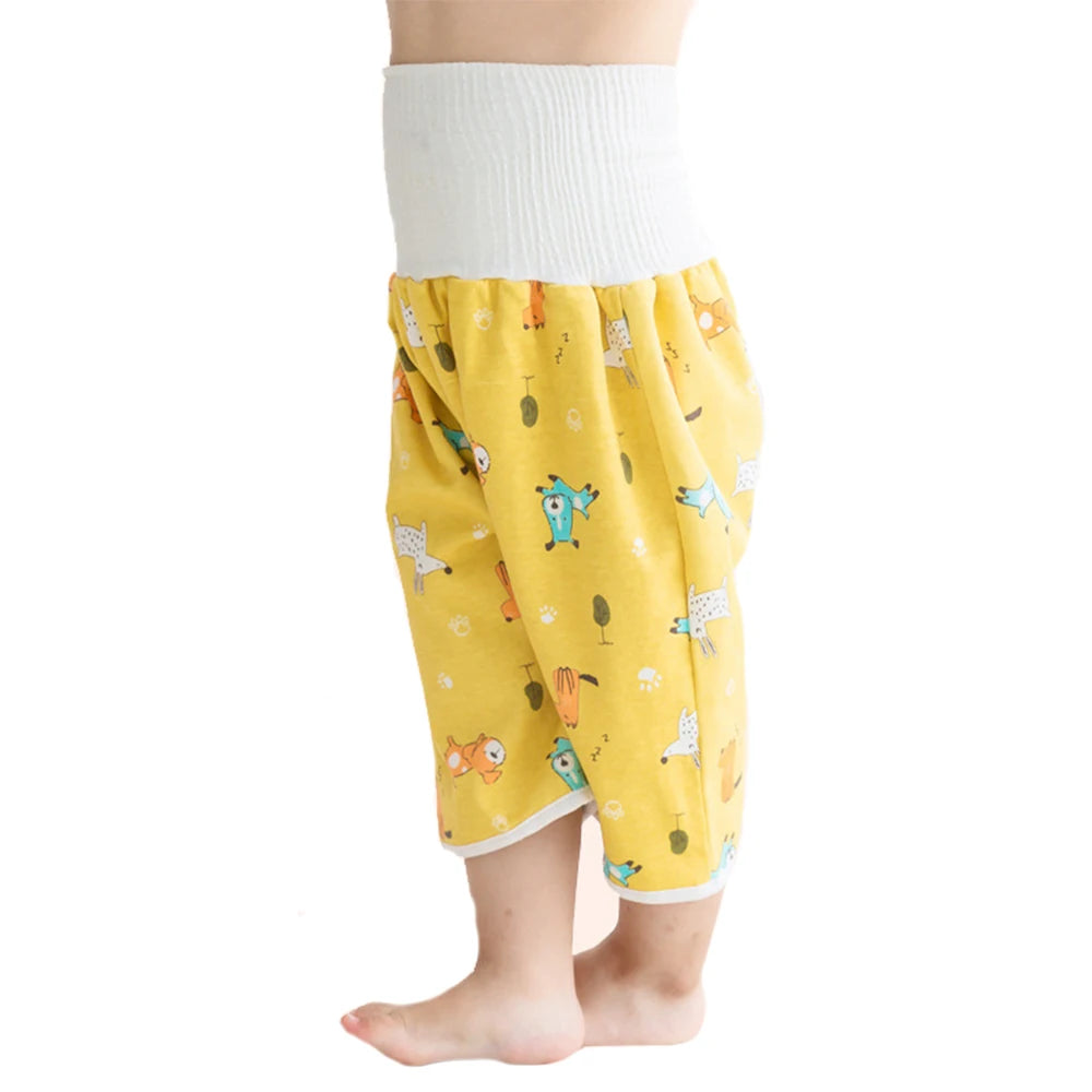 Yellow waterproof baby diaper pants with a skirt featuring colorful animal patterns