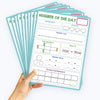 A stack of Number of the Day Maths posters for kids featuring dry erase place value and number line learning charts.