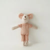 A handmade mouse plush doll with pink ears and a knitted outfit.