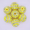 A pack of ten yellow and silver striped resin beads for jewelry making, shaped like small balls.