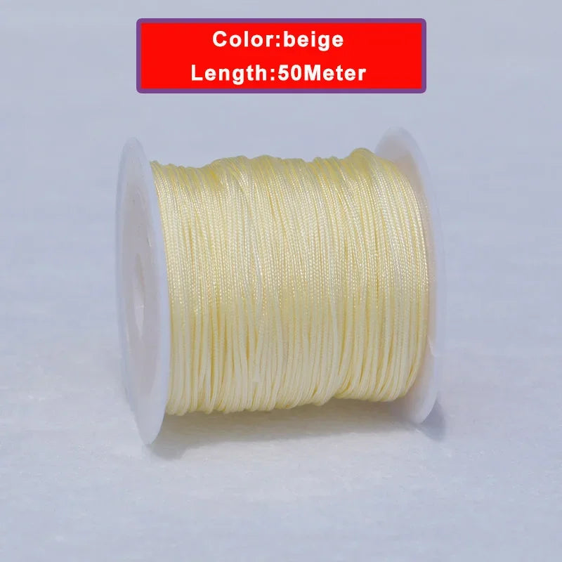 A spool of beige 0.8mm nylon knotting cord for jewelry making, measuring 50 meters long.