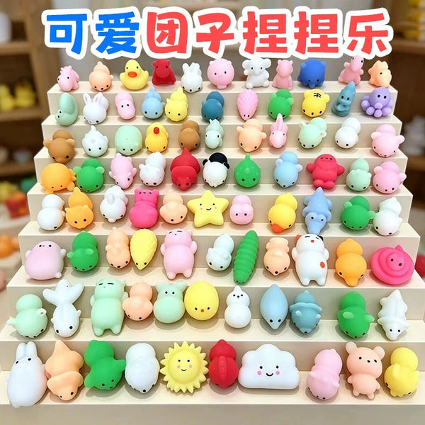 A large set of cute squishy mochi stress relief toys in various pastel and bright colors arranged in rows.
