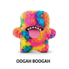 A brightly colored, fluffy plush monster with purple eyes and a wide pink tongue.