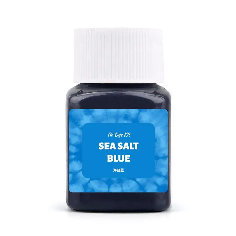 A small glass bottle of Sea Salt Blue textile fabric dye kit with a white cap.