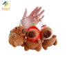 A hand holds three adorable capybara plush keychain charms with gold-colored chains.