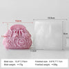 A pink silicone mold shaped like a flower is shown next to its finished product, a white bar of soap or candle.